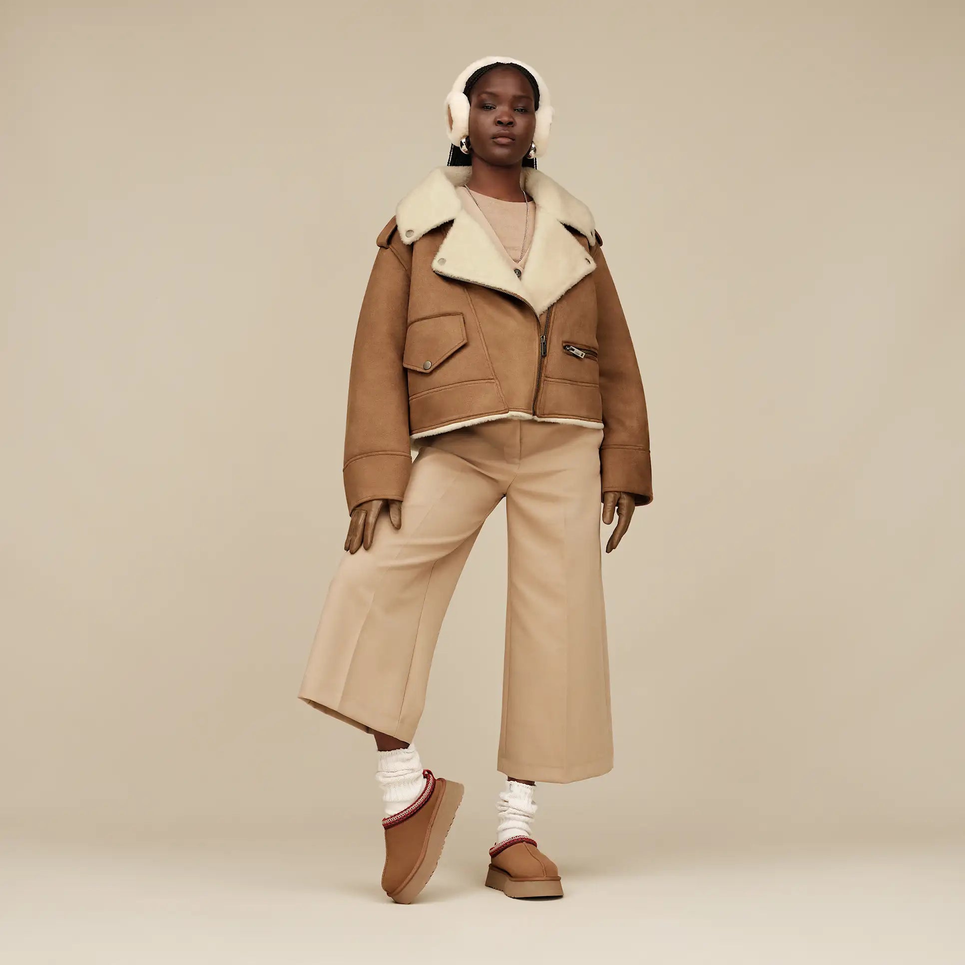 Femme Cache-oreilles en peau de mouton adapté à la technologie sans fil