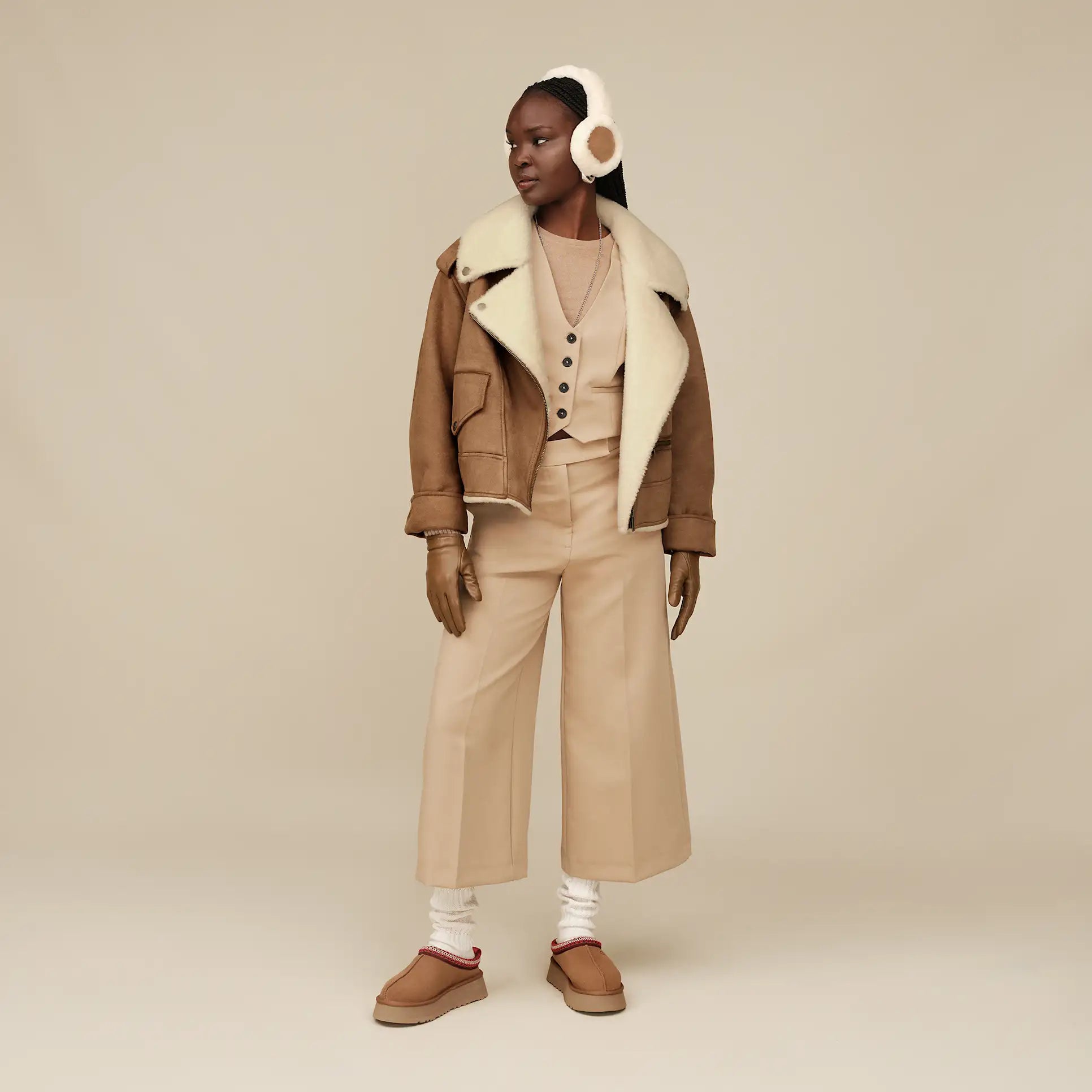 Femme Cache-oreilles en peau de mouton adapté à la technologie sans fil